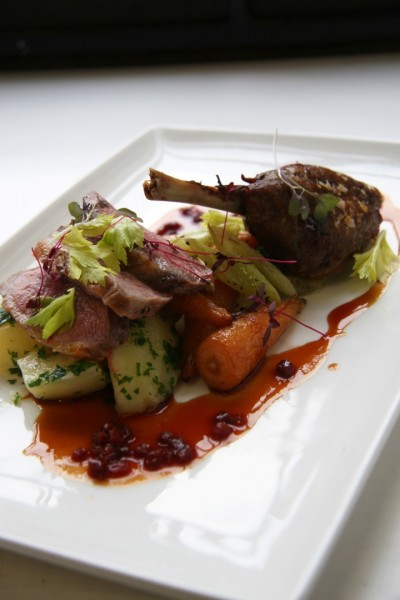 Duck breast with slow cooked leg, parsley potatoes, roast carrots and celery, lightly pickled cucumber, beetroot jus