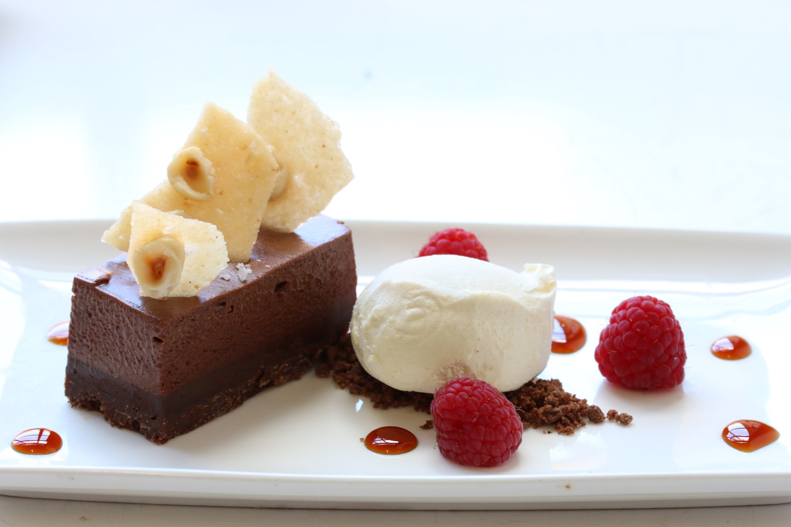 Salted chocolate caramel torte with hazlenut croquant, caramel gel and malt icecream