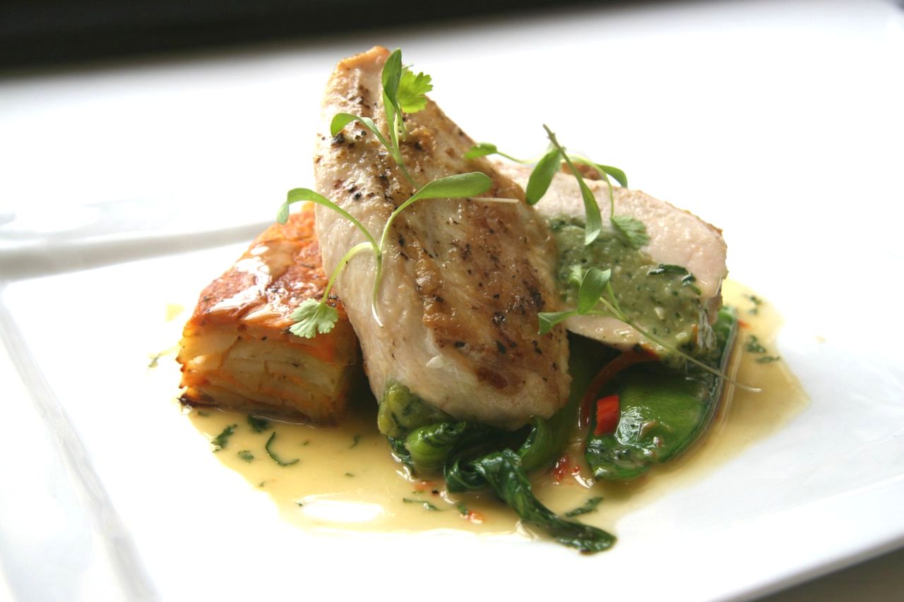 Breast of chicken stuffed with Thai herbs, sweet potato galette, mange tout and greens with a lime and chilli butter sauce